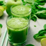 green liquid in clear drinking glass