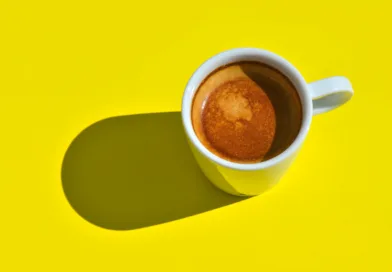 white ceramic mug with brown liquid