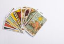 a deck of tarot cards on a white surface