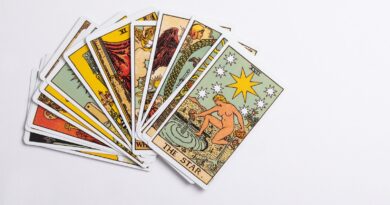a deck of tarot cards on a white surface